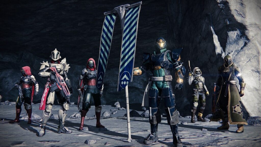 Imagem do jogo mostrando um personagem segurando uma bandeira e outros atrás fortemente armados.