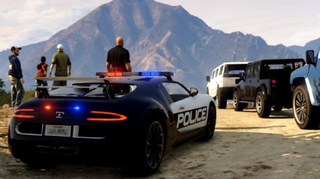 Imagem do jogo mostrando pessoas reunidas em um topo de uma montanha, até o carro da polícia está no local.